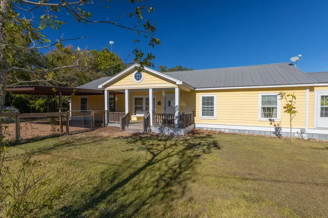front view of a house with a yard