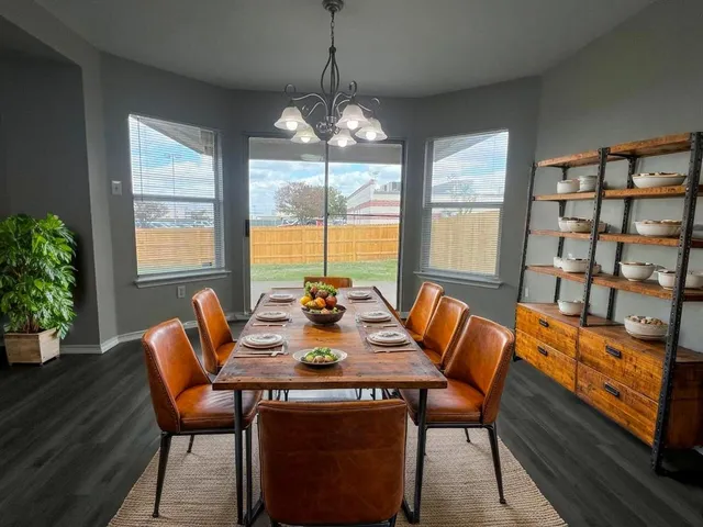 a view of a dining room with furniture window and outside view