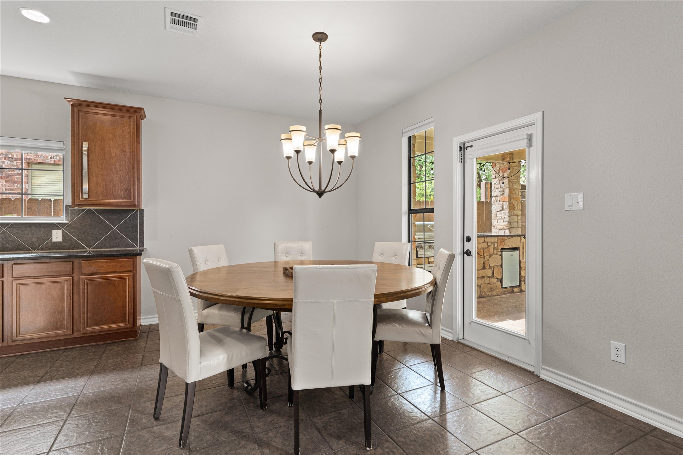 101 Breakaway Road Cedar Park, TX 78613 - Photo 11 of 37 Dining area featuring suspended lighting and baseboards