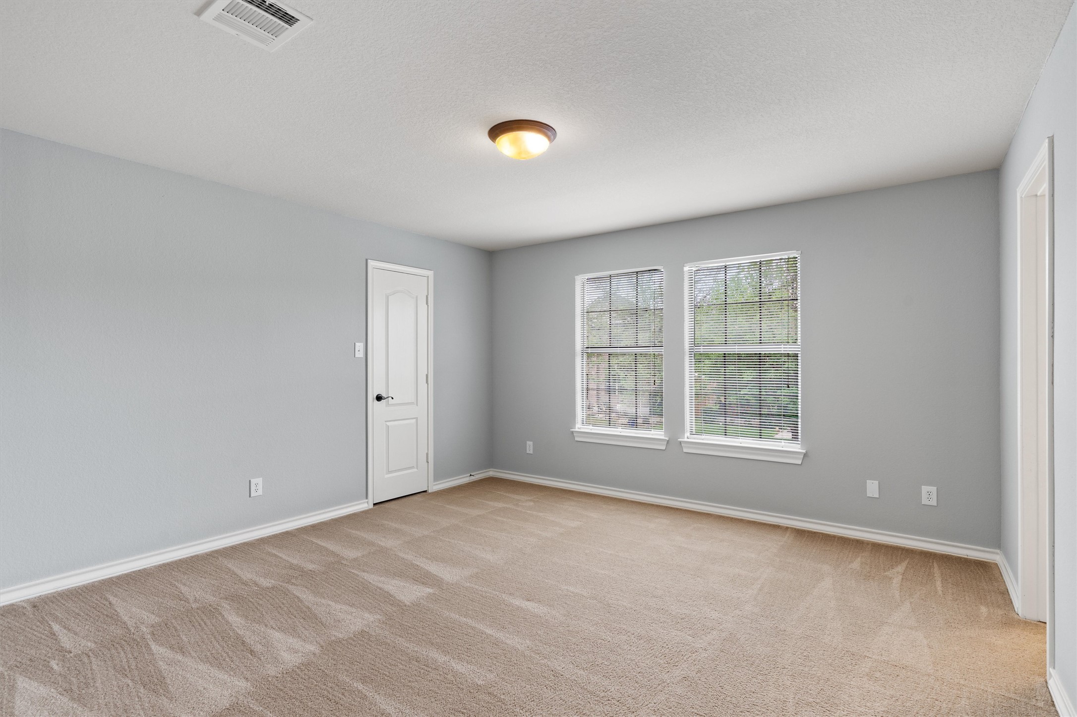 101 Breakaway Road Cedar Park, TX 78613 - Photo 27 of 37 Unfurnished room featuring baseboards and light carpet