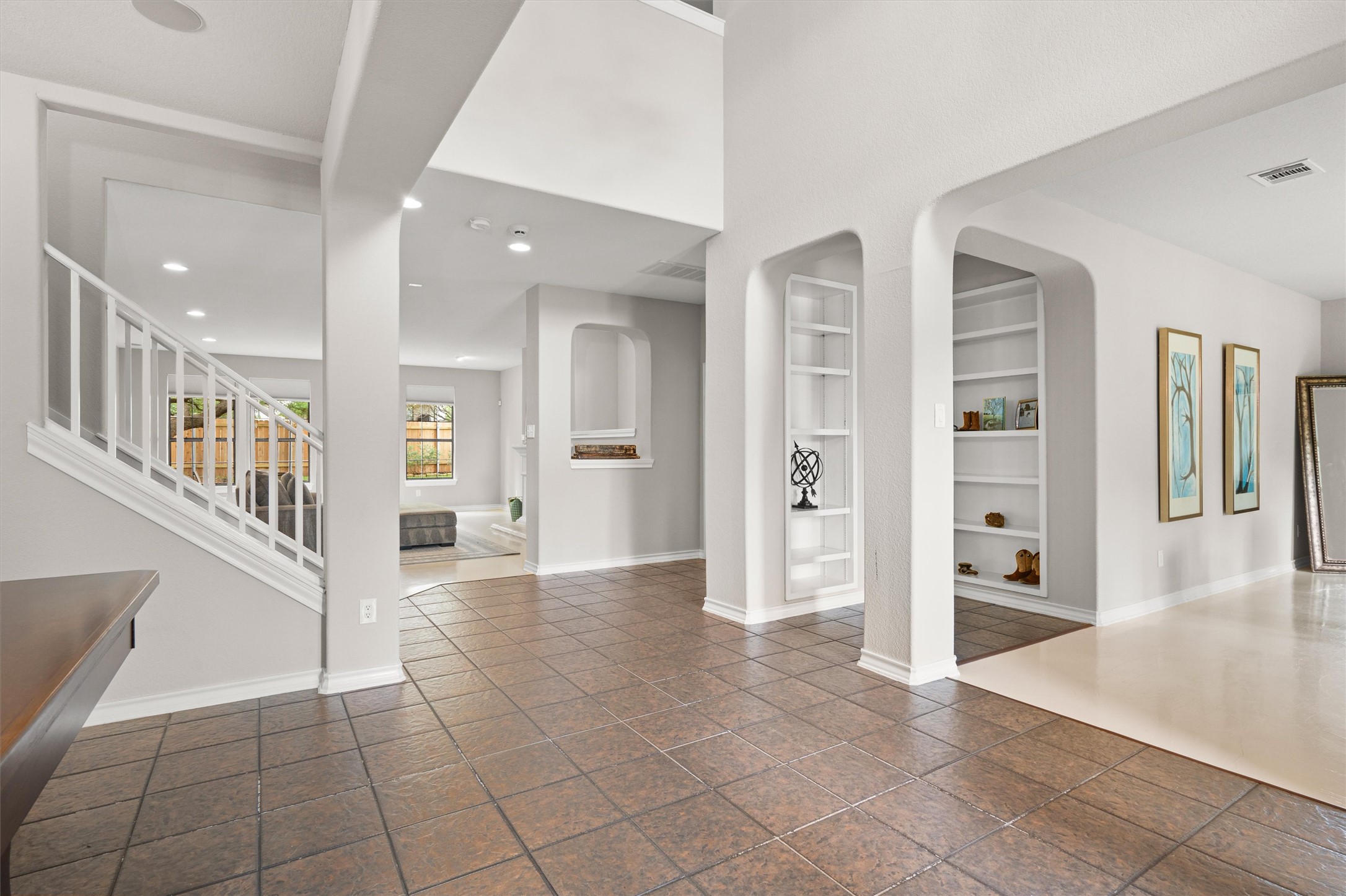 101 Breakaway Road Cedar Park, TX 78613 - Photo 8 of 37 Foyer entrance with a high ceiling, recessed lighting, and arched walkways