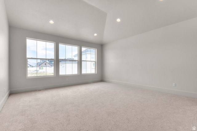11718 South Halls Crk Road Draper, UT 84020 - Photo 18 of 28 Spare room with recessed lighting, light colored carpet, and vaulted ceiling
