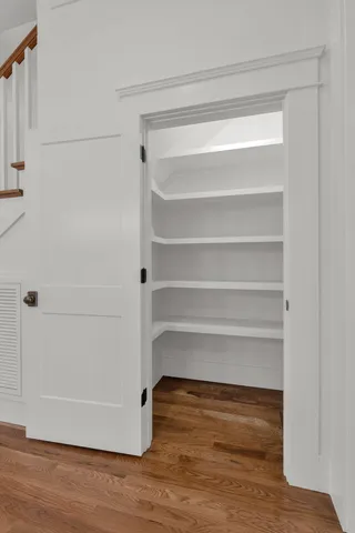a view of walk in closet with empty racks