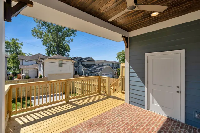 a view of a balcony with wooden floor and outdoor space