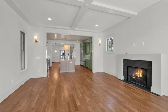 a view of an empty room and fire place