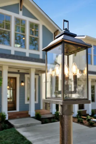 a front view of a house with a floor to ceiling windows