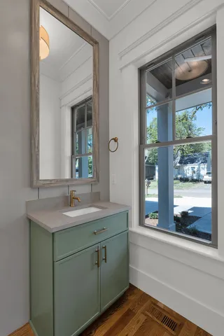 a bathroom with a sink and a large mirror