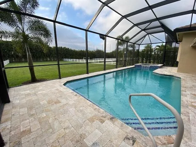a view of swimming pool with a patio