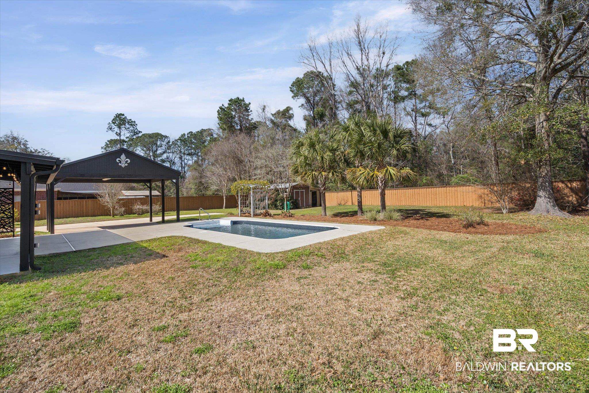 3216 Bay Booster Club Road Theodore, AL 36582 - Photo 27 of 46 Fenced backyard with a patio and a storage shed
