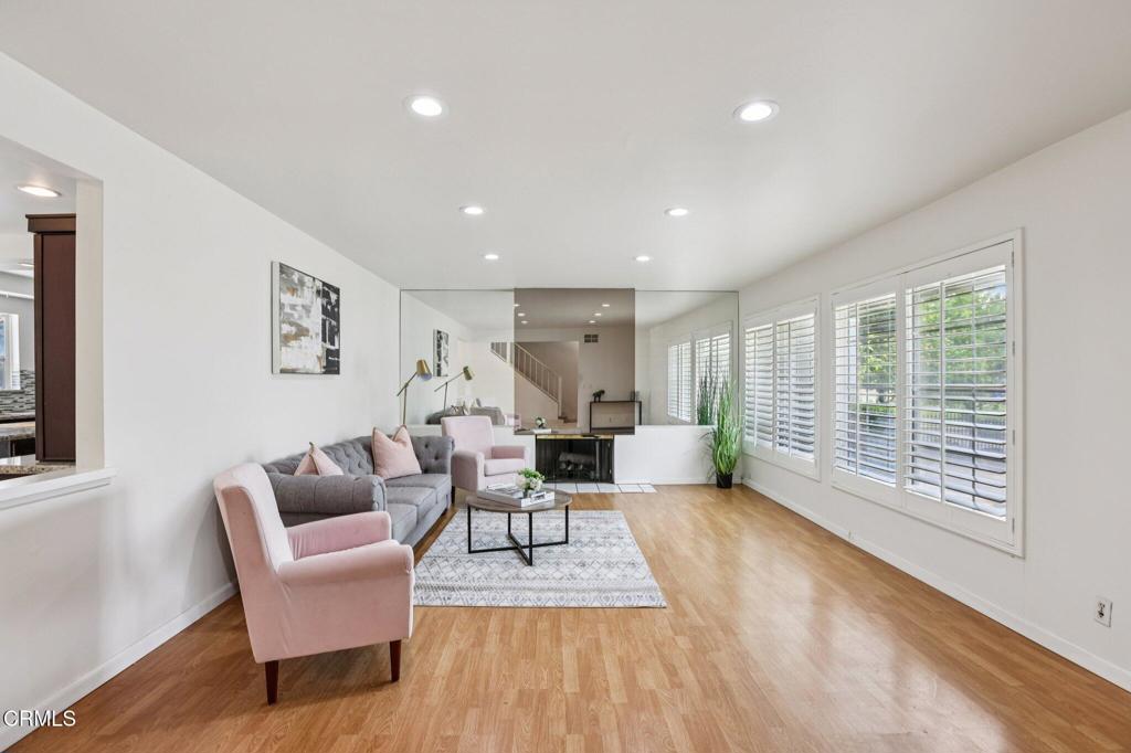 10856 Topeka Drive Porter Ranch, CA 91326 - Photo 5 of 40 a living room with furniture and a large window