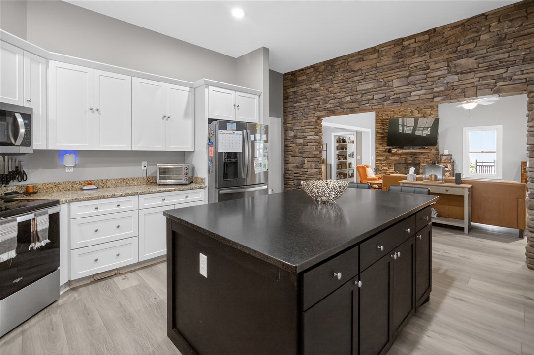1504 Double Springs Road Townville, SC 29689 - Photo 6 of 41 This modern kitchen seamlessly flows into a welcoming living area, perfect for daily living and entertaining.