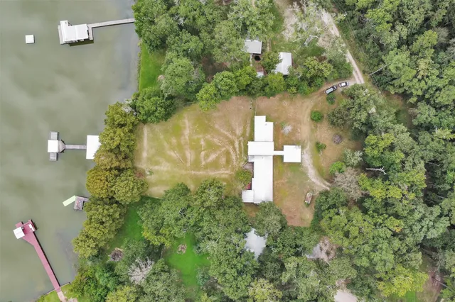 an aerial view of a house with a yard