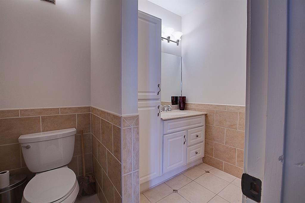 342 Marietta Street Northwest, Unit 1 Atlanta, GA 30313 - Photo 5 of 9 a bathroom with a toilet sink and mirror