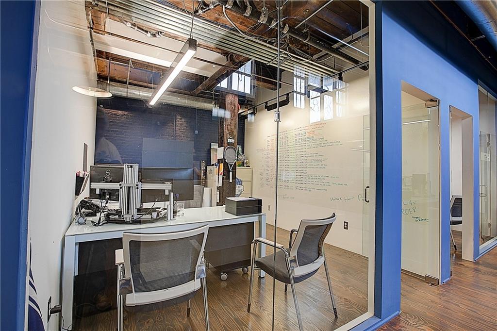342 Marietta Street Northwest, Unit 1 Atlanta, GA 30313 - Photo 7 of 9 a dining room with furniture and wooden floor