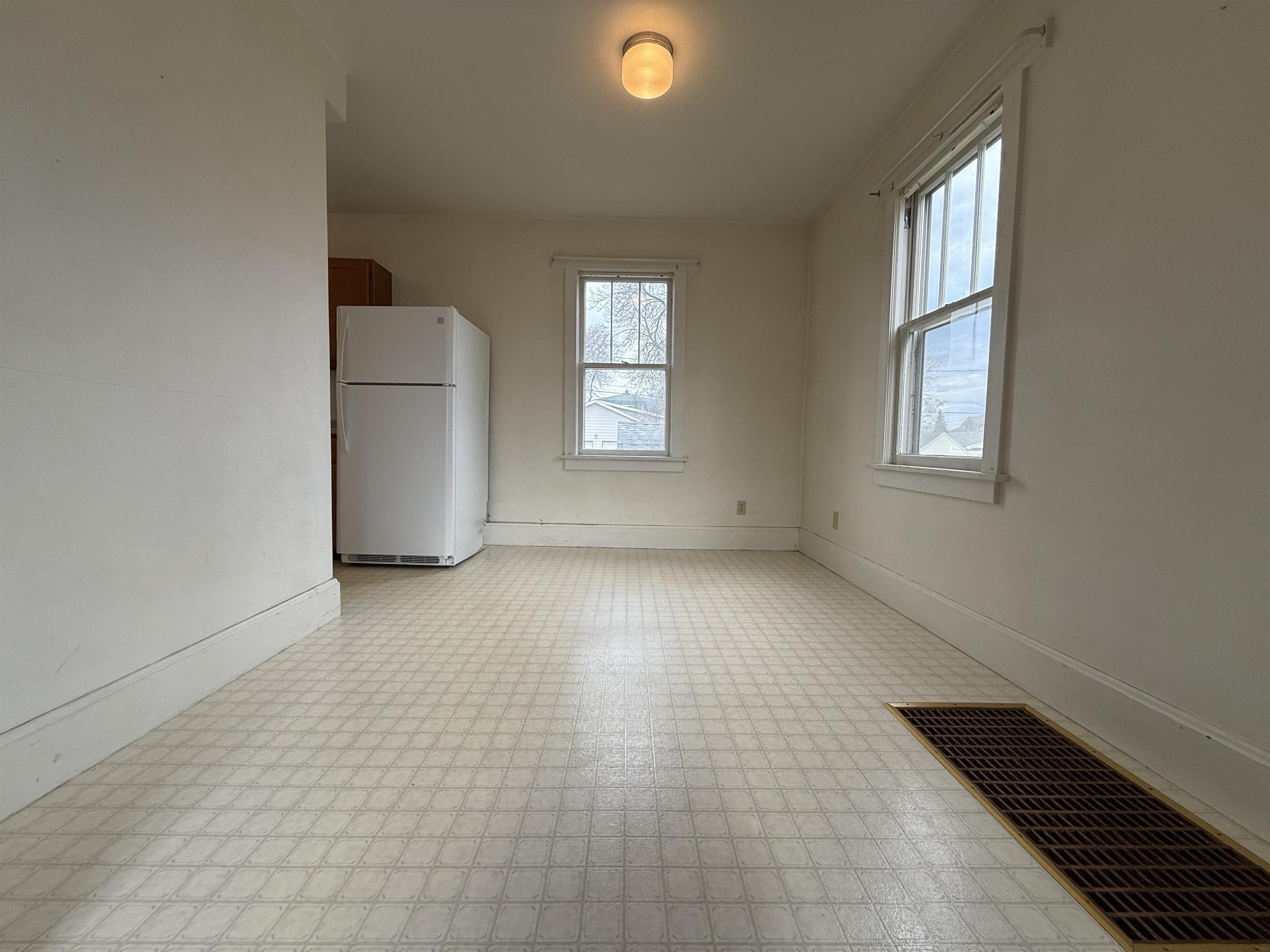 214 8th Street Southwest Chisholm, MN 55719 - Photo 11 of 25 Unfurnished room featuring light flooring and baseboards