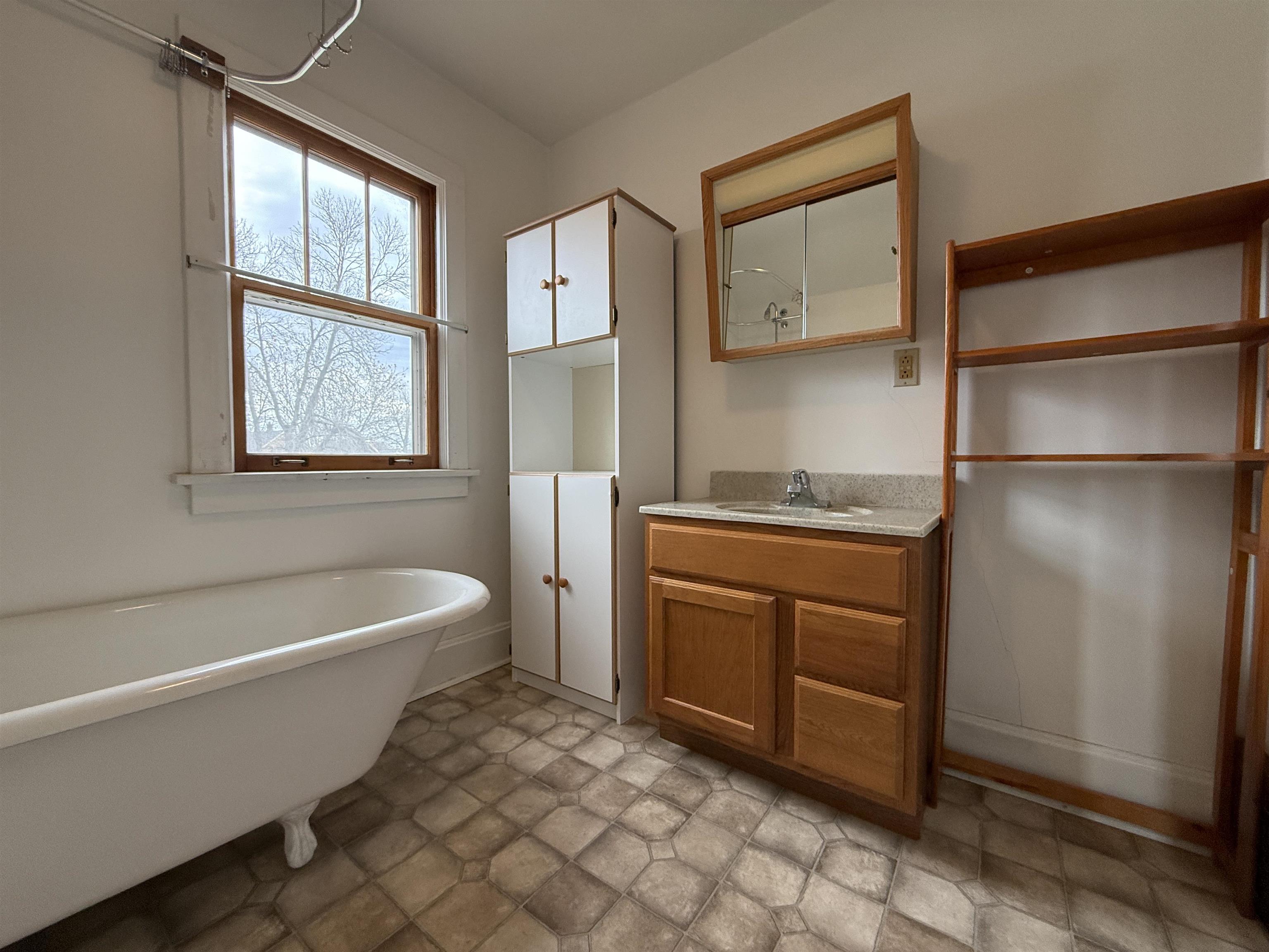214 8th Street Southwest Chisholm, MN 55719 - Photo 18 of 25 Bathroom with a soaking tub and vanity
