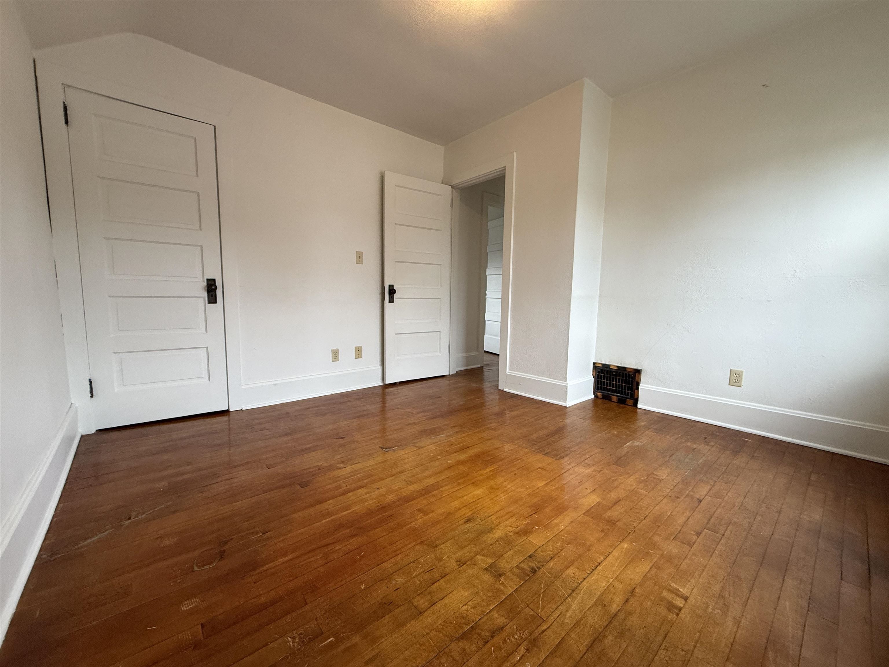 214 8th Street Southwest Chisholm, MN 55719 - Photo 22 of 25 Unfurnished bedroom featuring dark wood-style floors and baseboards