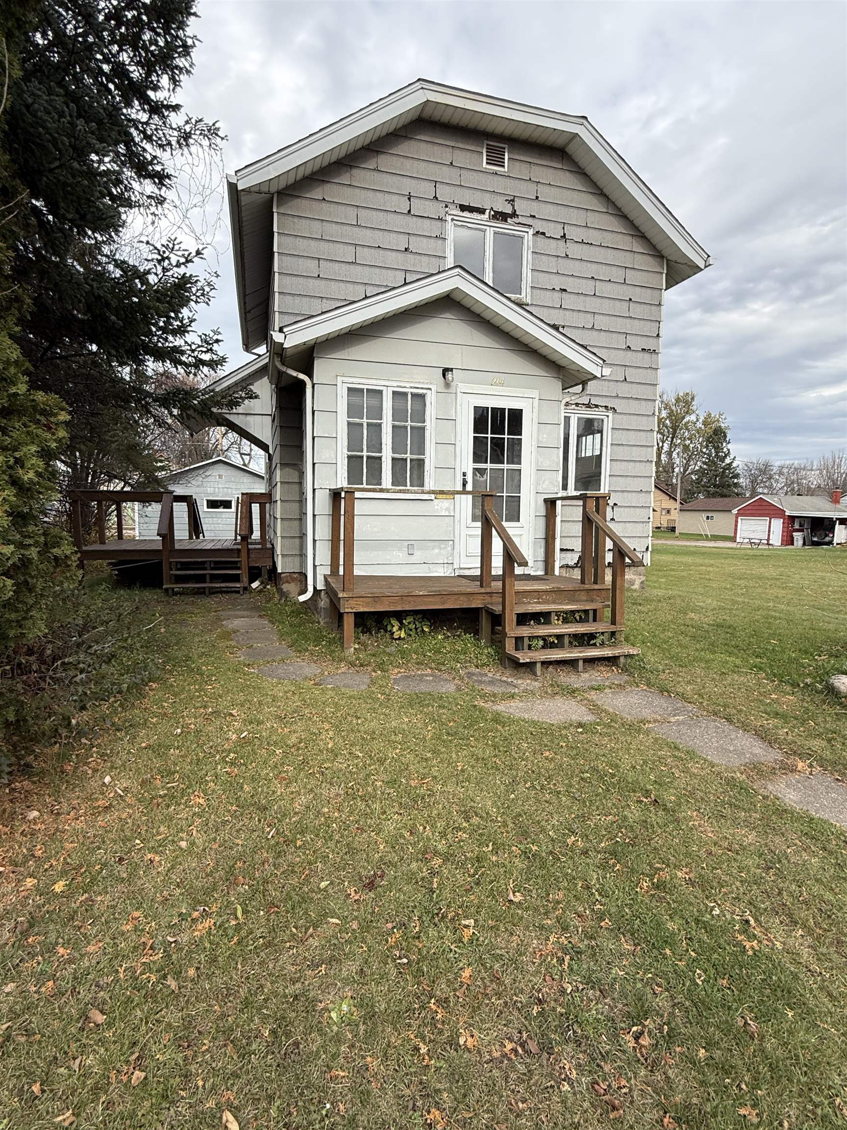 214 8th Street Southwest Chisholm, MN 55719 - Photo 25 of 25 Back of house with a lawn and a deck