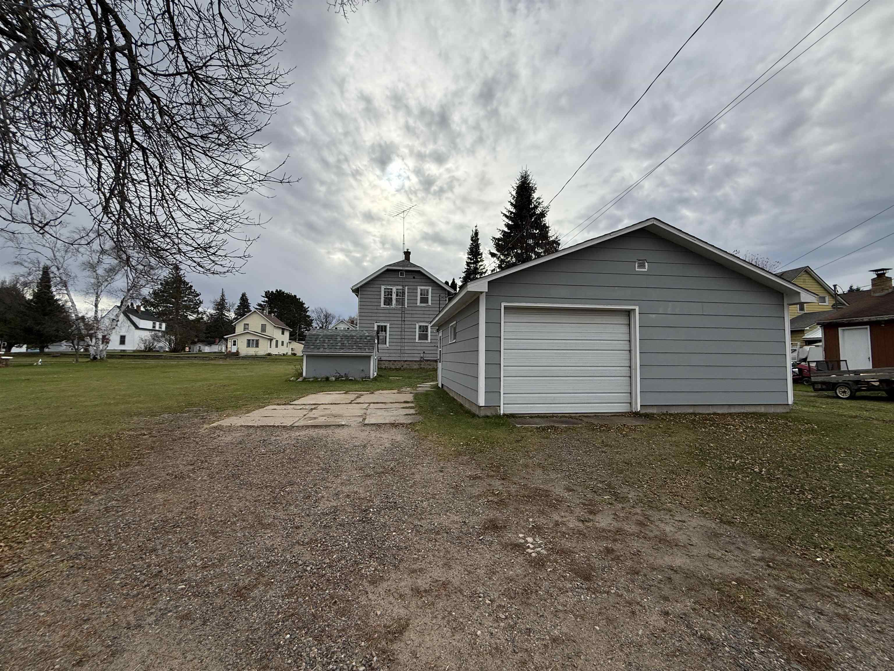 214 8th Street Southwest Chisholm, MN 55719 - Photo 4 of 25 Detached garage featuring dirt driveway