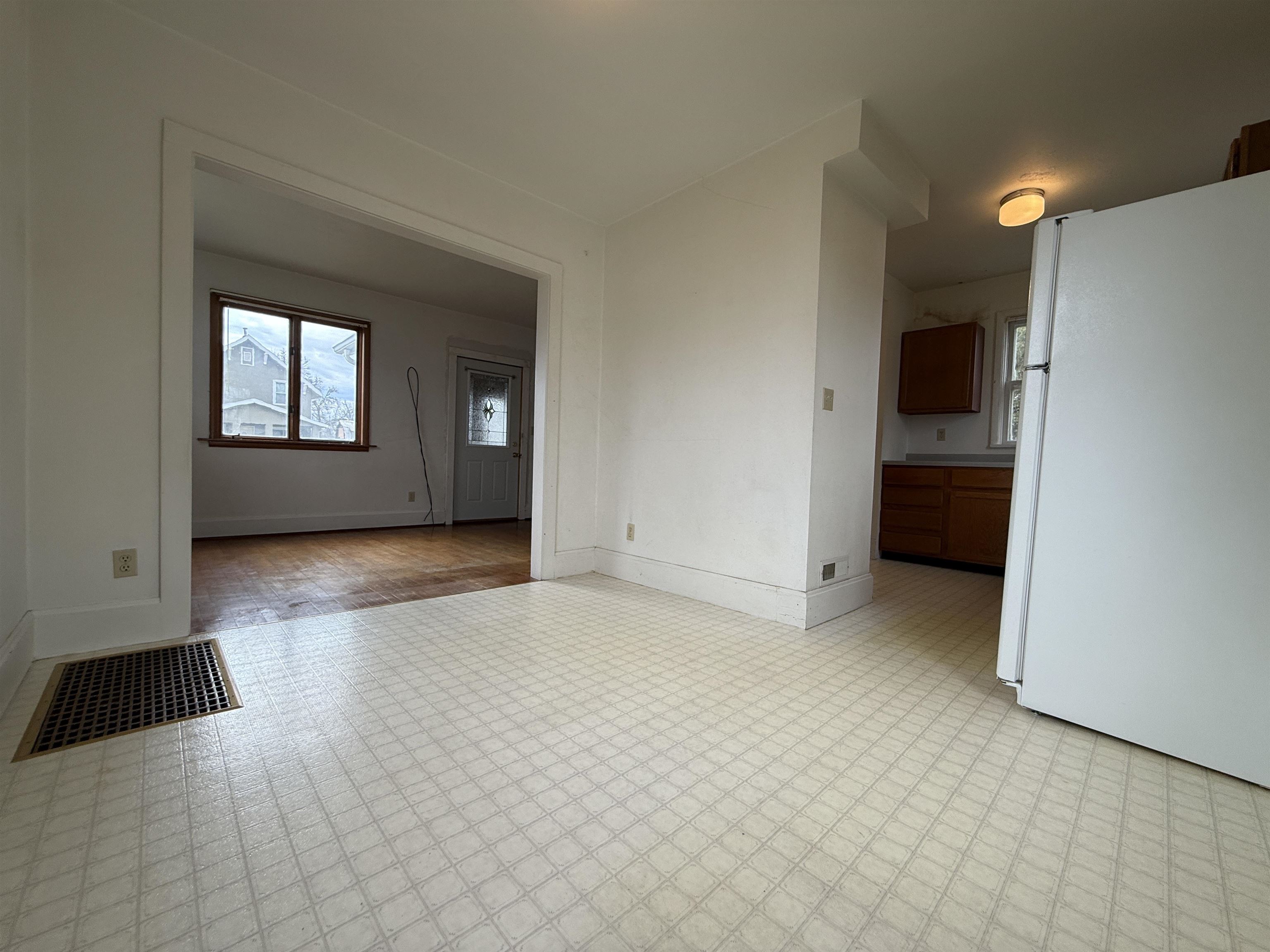 214 8th Street Southwest Chisholm, MN 55719 - Photo 10 of 25 Unfurnished living room featuring baseboards and light flooring