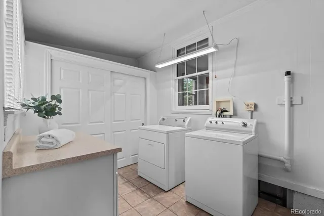 a view of a sink and dishwasher with wooden floor