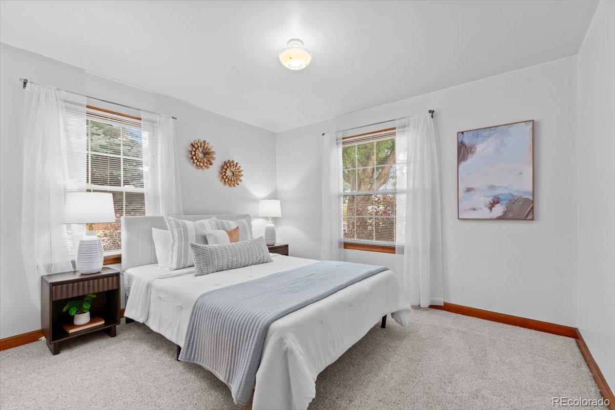 4095 Quay Street Wheat Ridge, CO 80033 - Photo 12 of 32 a bedroom with a bed and a window