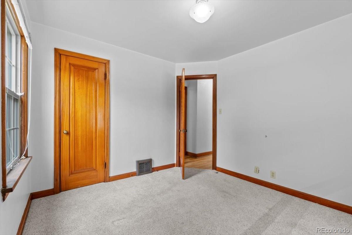 4095 Quay Street Wheat Ridge, CO 80033 - Photo 15 of 32 a view of an empty room with a window