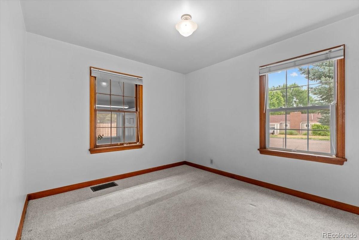 4095 Quay Street Wheat Ridge, CO 80033 - Photo 16 of 32 an empty room with windows