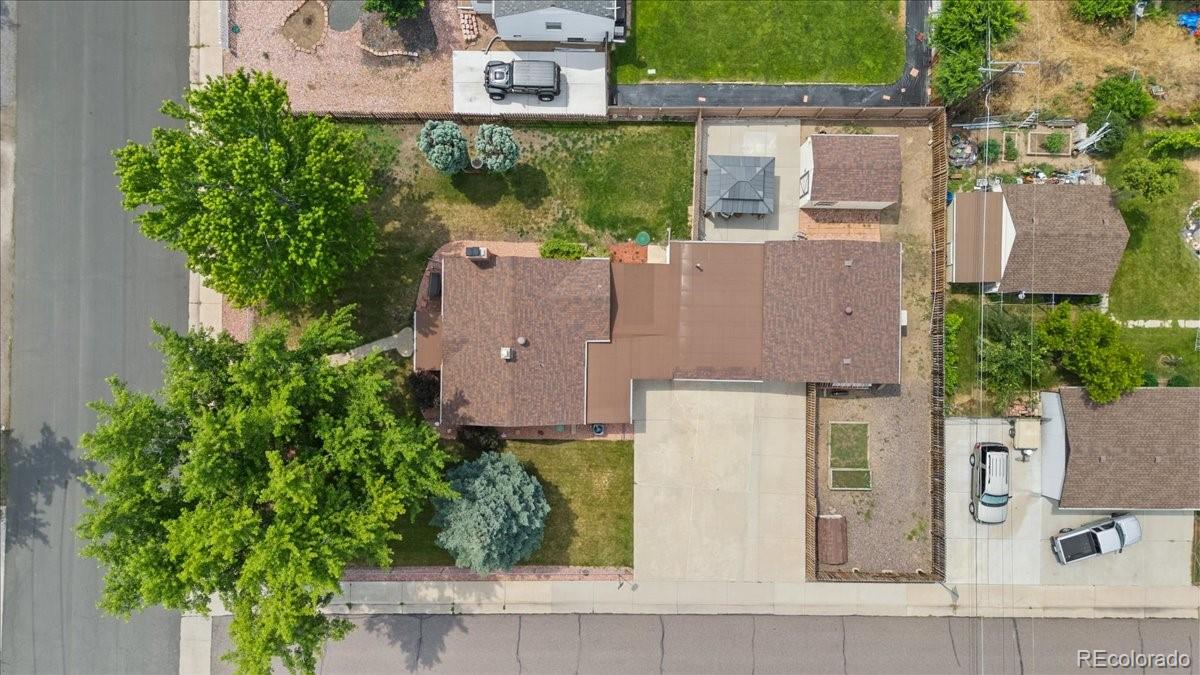 4095 Quay Street Wheat Ridge, CO 80033 - Photo 29 of 32 an aerial view of a house with a garden and a yard