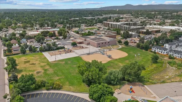 an aerial view of residential houses with outdoor space