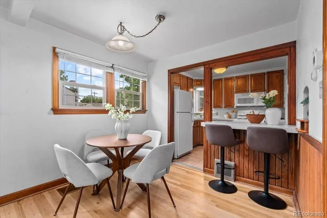 a view of a dining room with furniture window and outside view