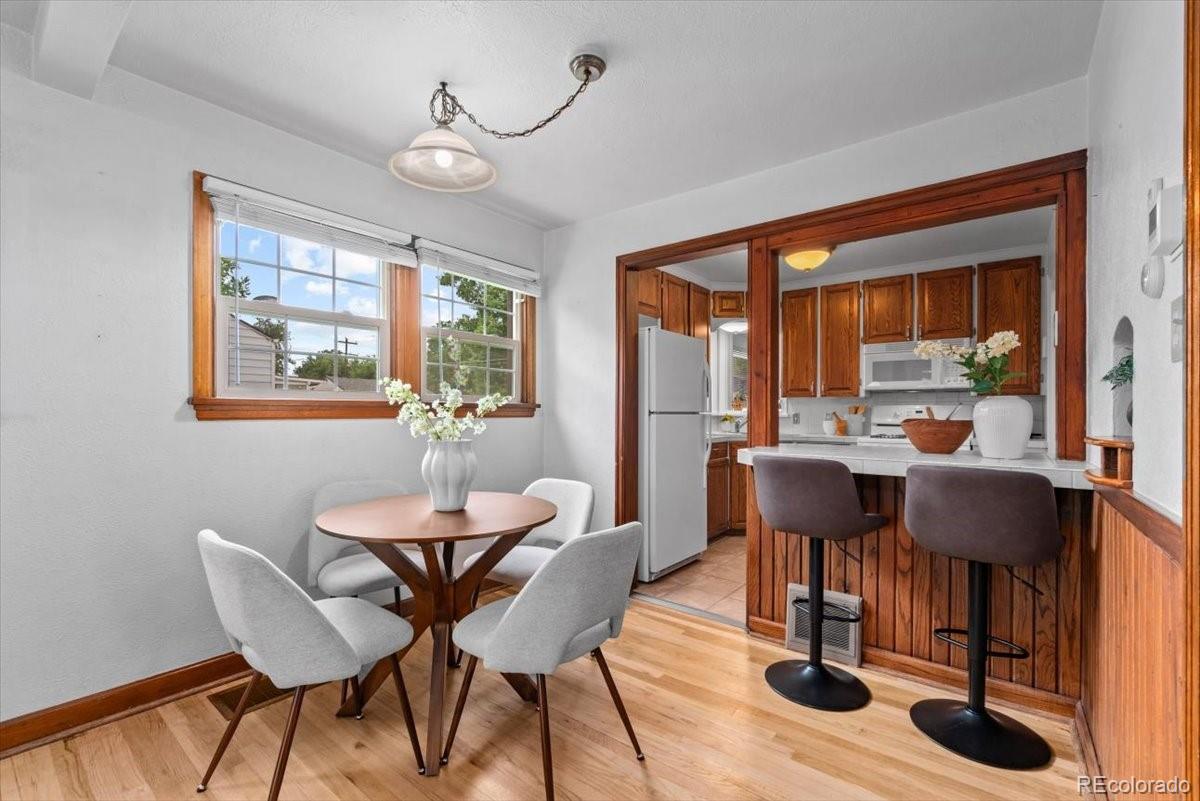 4095 Quay Street Wheat Ridge, CO 80033 - Photo 6 of 32 a view of a dining room with furniture window and outside view