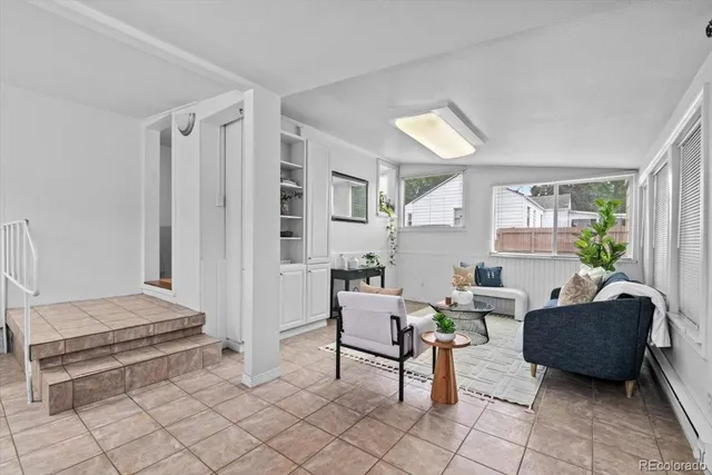a living room with furniture and a table