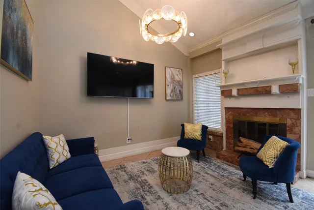 a living room with furniture kitchen view and a table