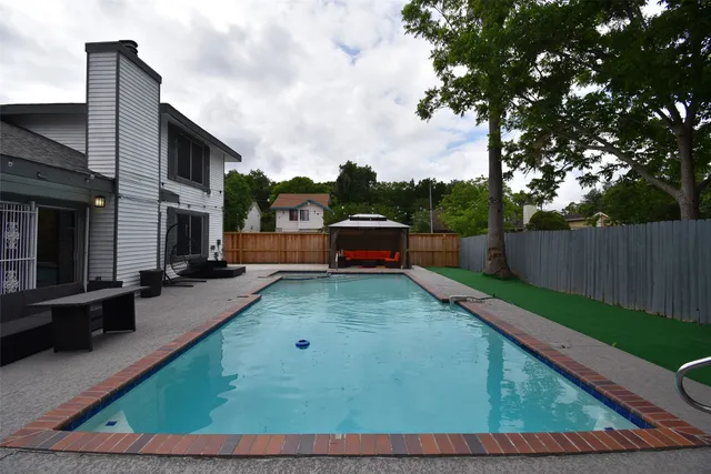 a view of entryway with a window and wooden floor