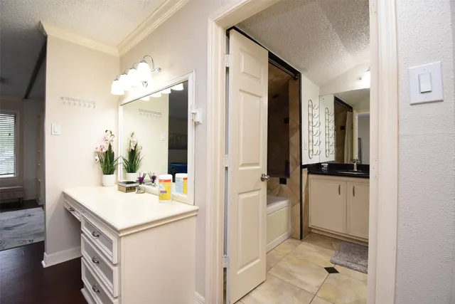 a bath room with a sink and a mirror