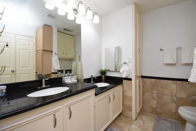 a view of hallway with stairs and a rug