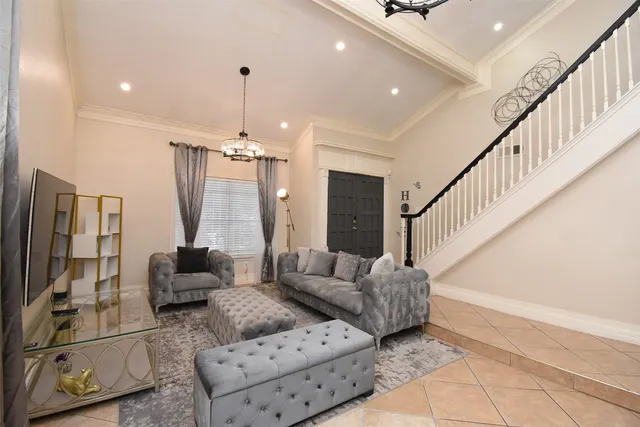 a kitchen with granite countertop white cabinets white appliances and sink
