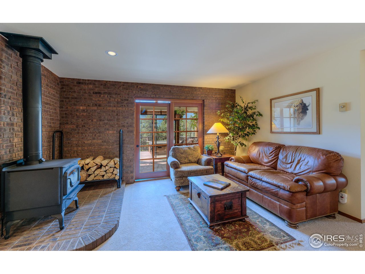 293 Broken Fence Road Boulder, CO 80302 - Photo 20 of 40 Warm, Cozy Family Room Walks Out to Sunroom