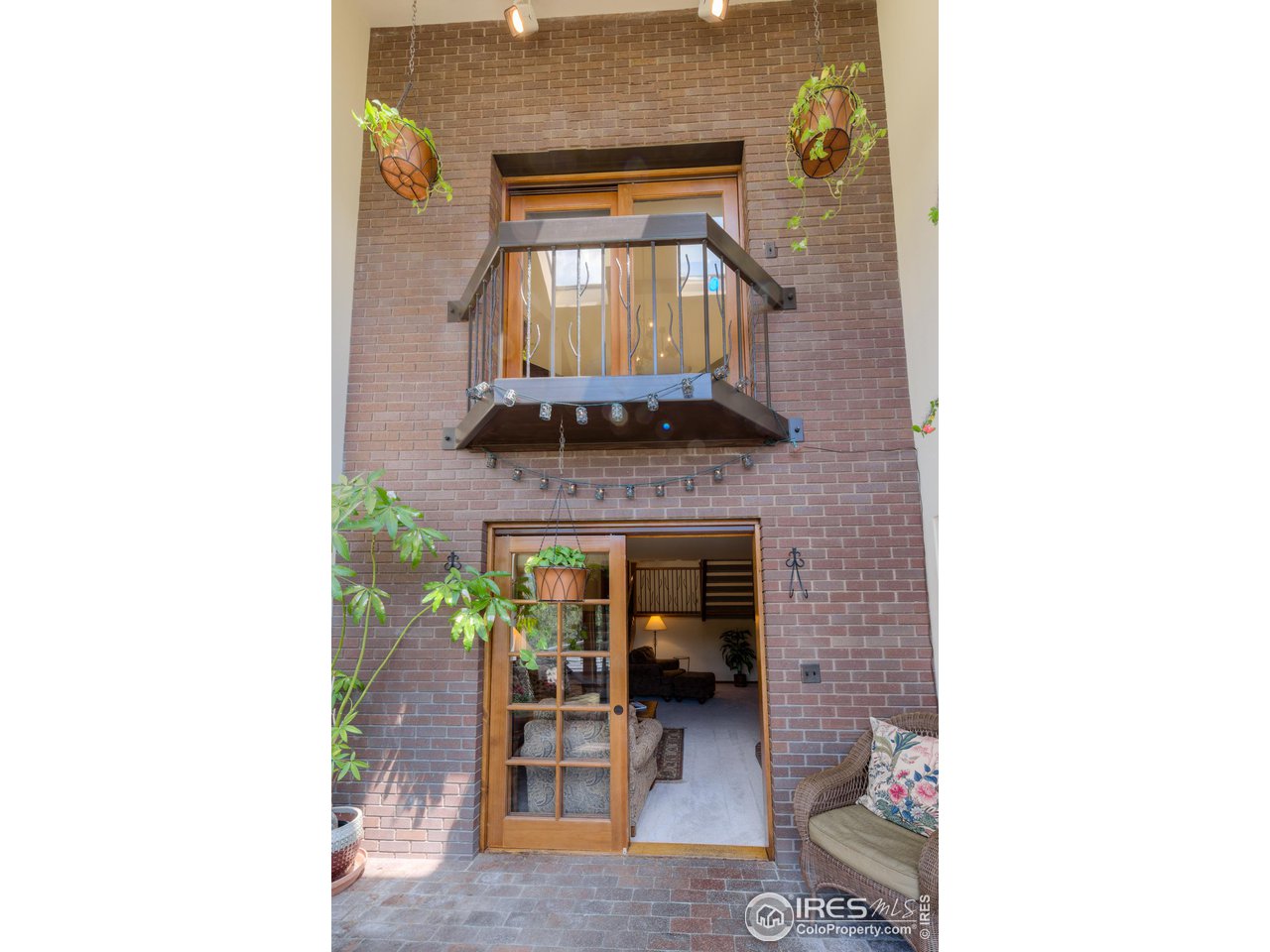293 Broken Fence Road Boulder, CO 80302 - Photo 27 of 40 Dramatic 2-Story Sunroom with Brick Trombe Wall for Passive Solar Gain