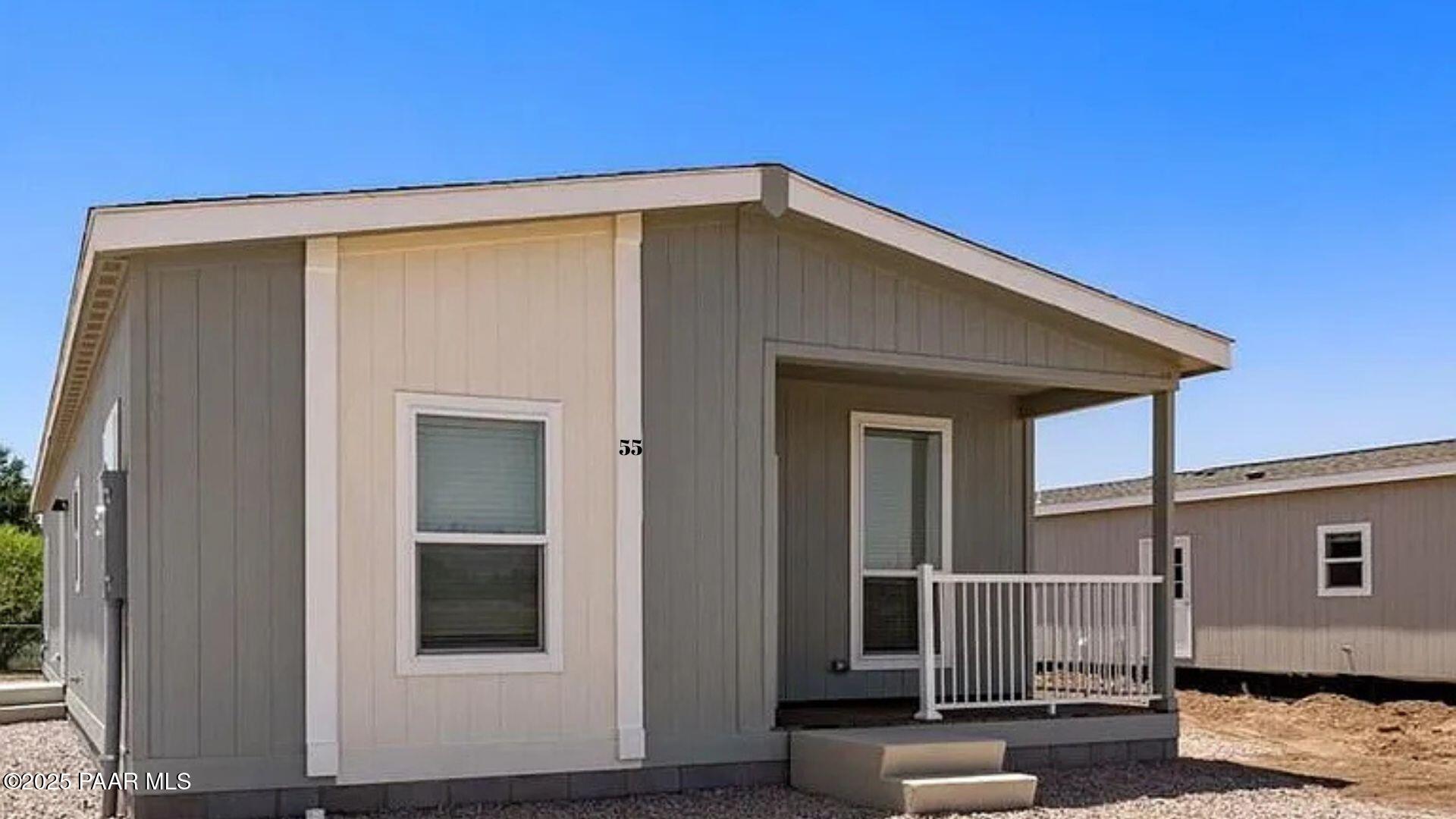 55 Hawaii Road Paulden, AZ 86334 - Photo 12 of 12 a front view of a house with garage