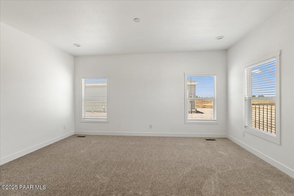 55 Hawaii Road Paulden, AZ 86334 - Photo 4 of 12 an empty room with windows