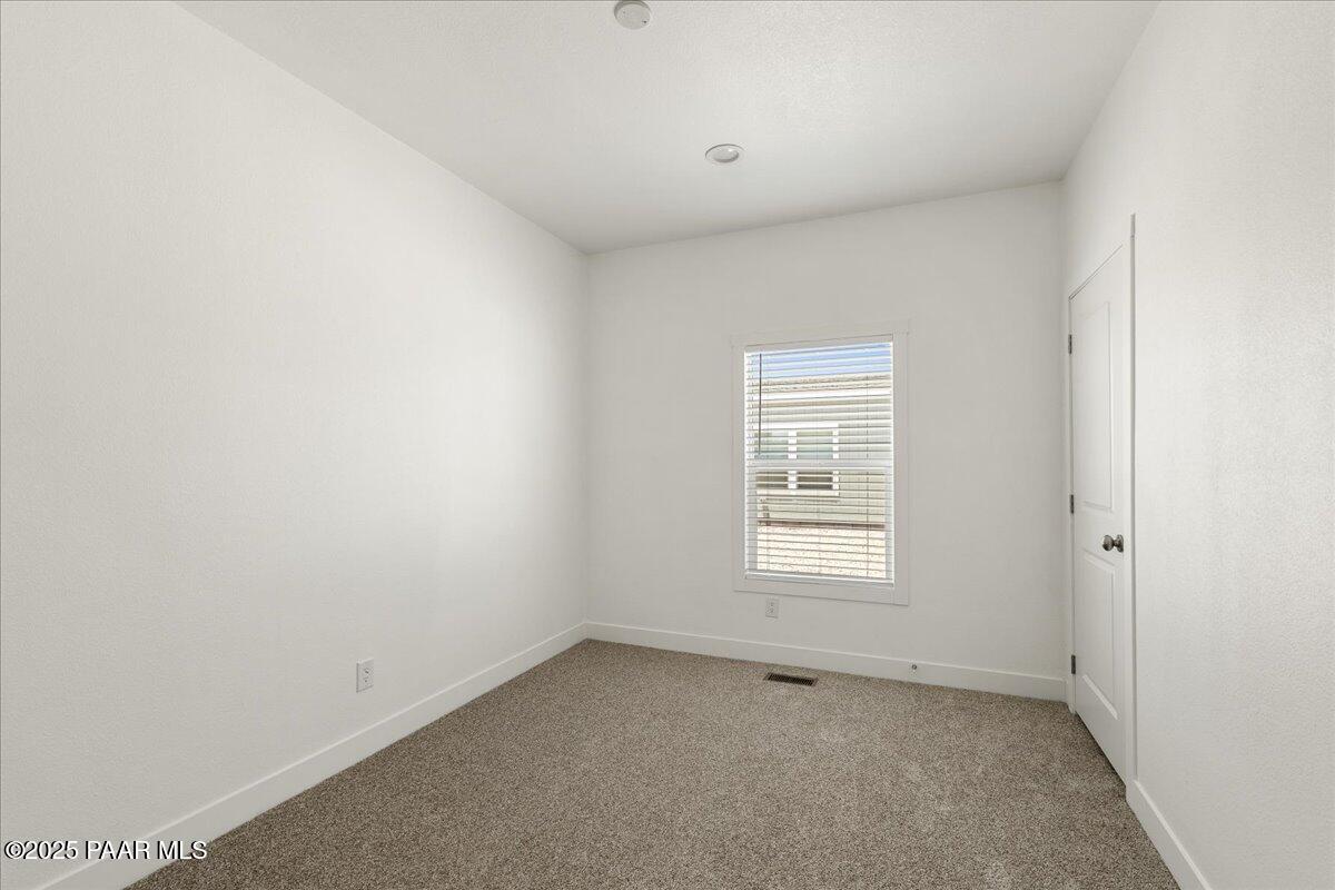 55 Hawaii Road Paulden, AZ 86334 - Photo 8 of 12 an empty room with a window