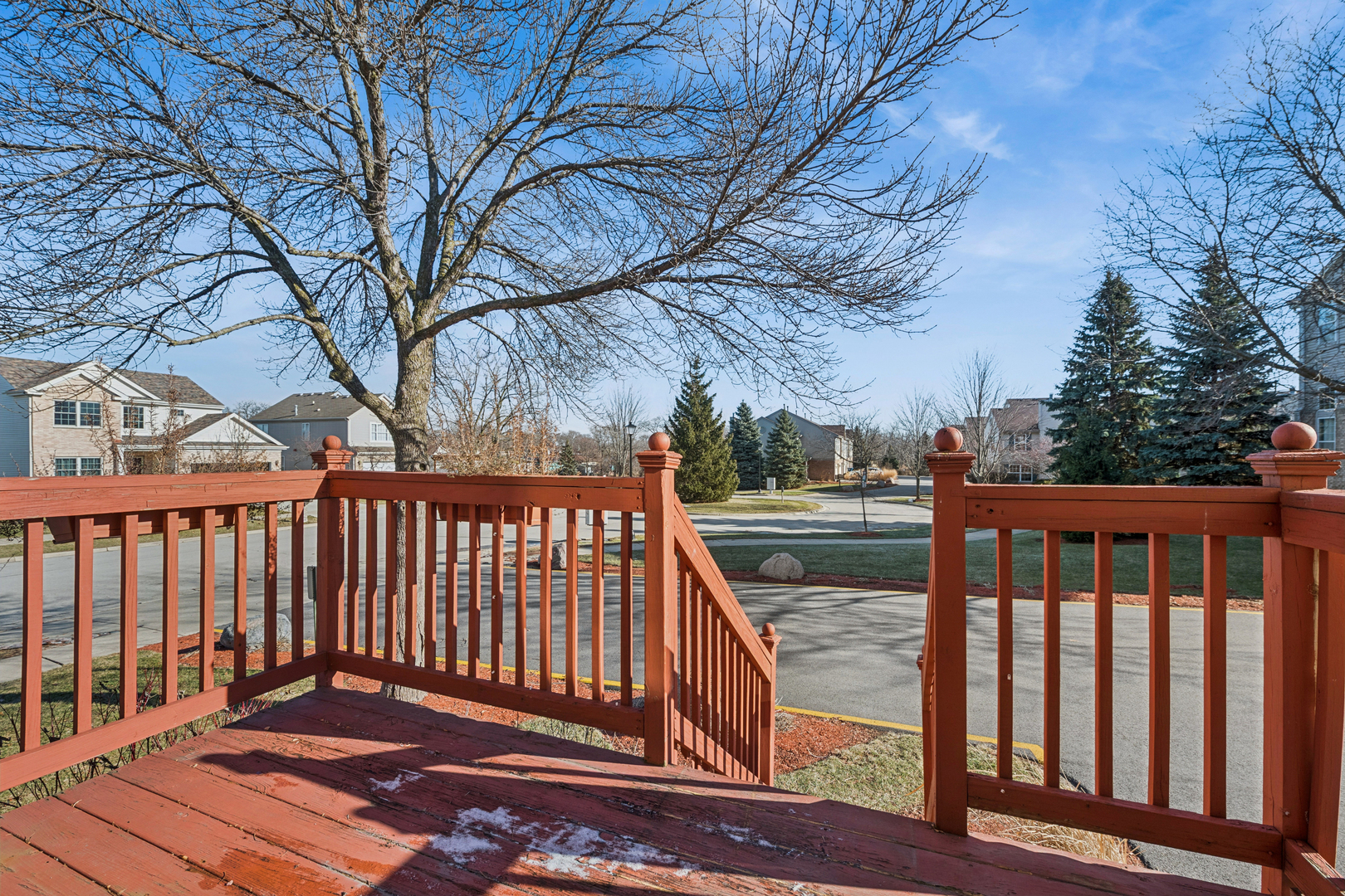 651 Georgian Court Addison, IL 60101 - Photo 23 of 24 a view of balcony with wooden floor and fence