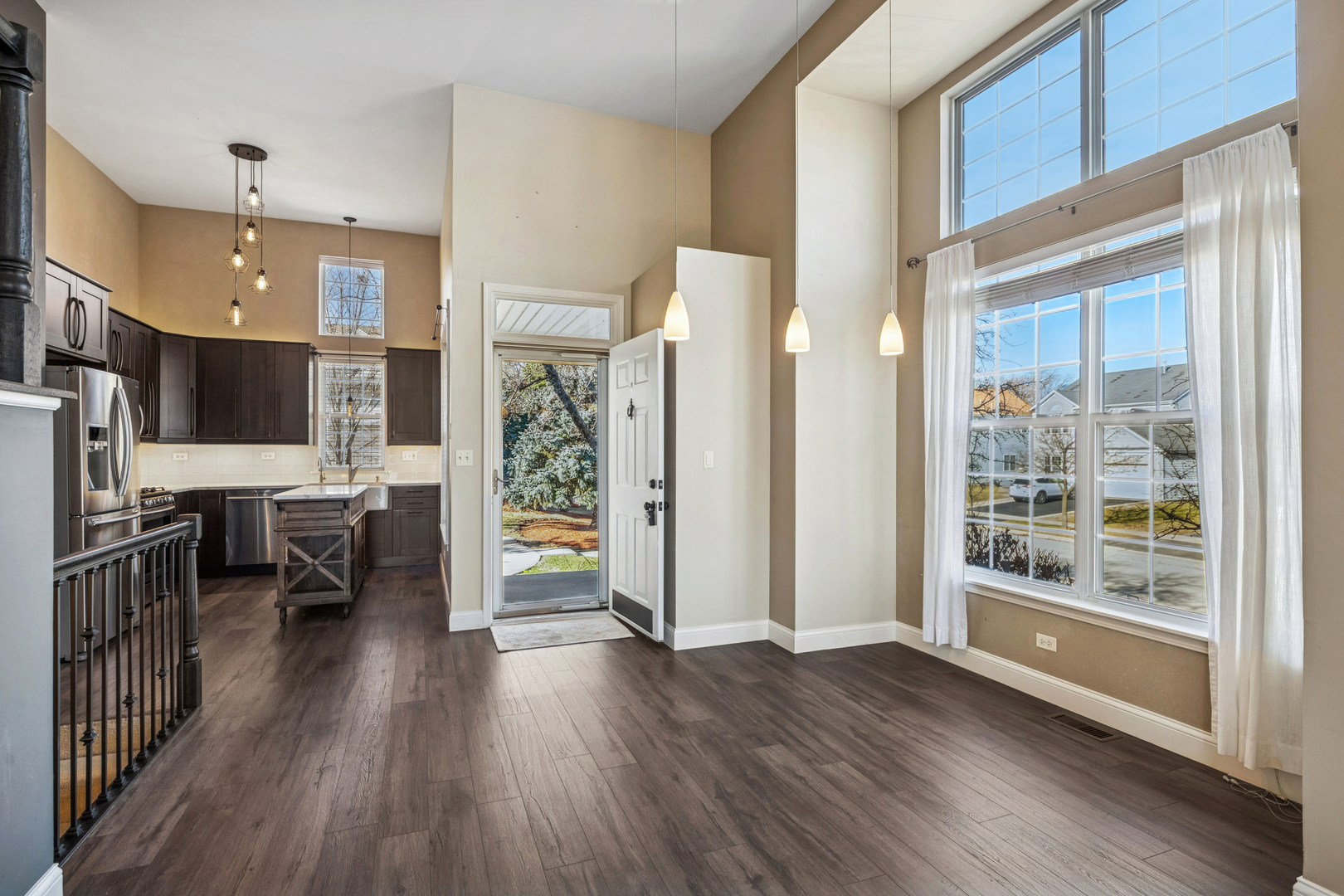 651 Georgian Court Addison, IL 60101 - Photo 6 of 24 a view of a kitchen with furniture and wooden floor