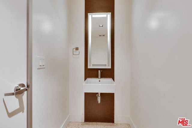 a bathroom with a shower and a mirror