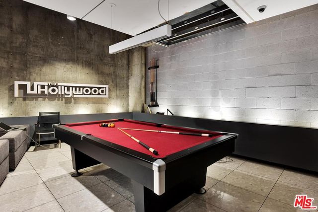 a room with pool table and wall