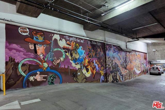 a view of parking garage with parked cars