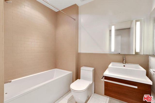 a bathroom with a sink a toilet and a bathtub