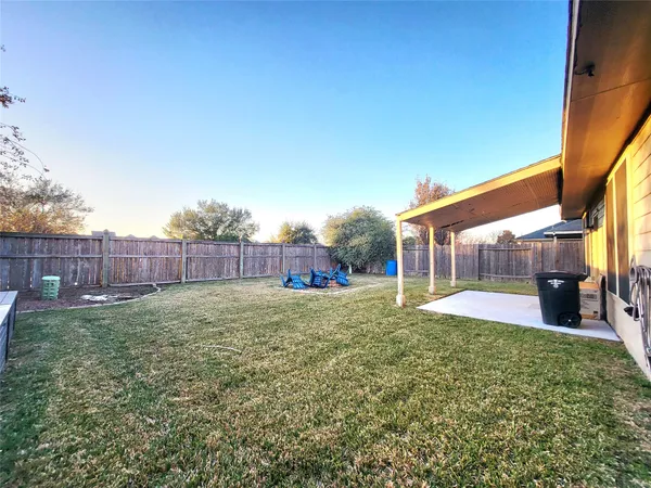 a view of a yard and a garage